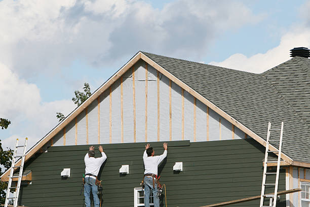 Professional Storm Damage Siding Repair technician working in Timberlake, NC